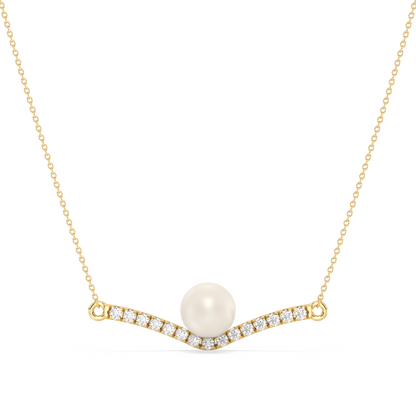 Gold necklace with a pearl and small diamonds on a white background